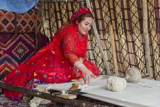 Qashqai woman weaving a carpet