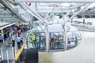 Entry into a gondola of the Millennium Wheel London Eye