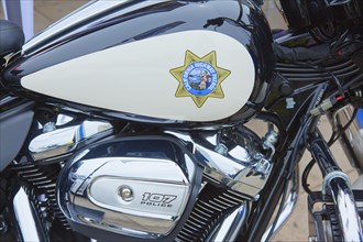 Logo of the California Highway Patrol on a tank of a Harley-Davidson Road King Police FLHP