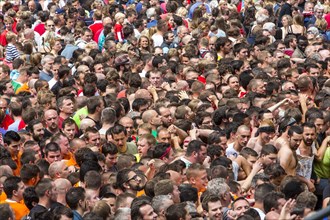 Densely packed crowd at a public festival