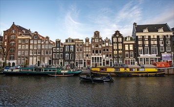 Singel Gracht with colourful houseboats and historic houses