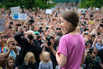 16-year-old Swedish climate activist Greta Thunberg addresses several thousand demonstrators at a Fridays for Future rally