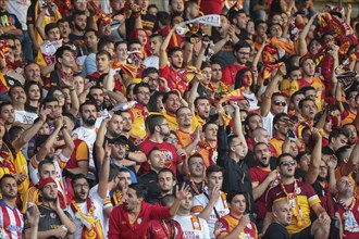 Fans of Galatasaray Istanbul cheer on their team during a friendly game against SK Rapid Vienna
