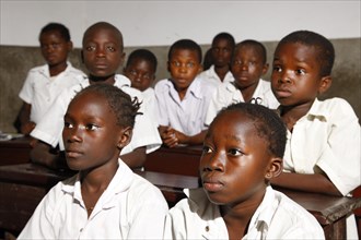 School children in school uniform during class