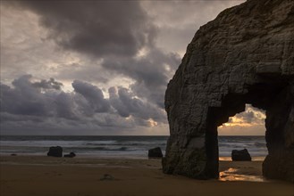 Port Blanc natural arch at sunset