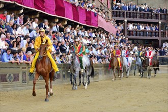 Horses and riders before the start of the historical horse race Palio di Siena