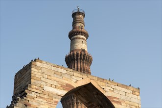 Arch of Quwwat-ul-Islam Mosque and Qutb Minar