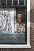 Display dummy in Dutch traditional costume in a window