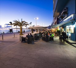 Coastal town of Puerto De Naos with restaurants in the evening