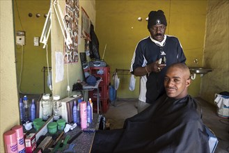 Local hairdresser cutting a customer's hair