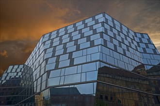 Modern building of the University Library with evening sky