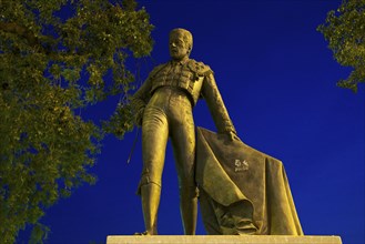 Statue of a bullfighter on the promenade of the Rio Guadalquivir