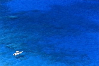 Boat in aquamarine water