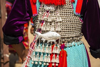 Traditionally decorated dress a woman from the Lisu people