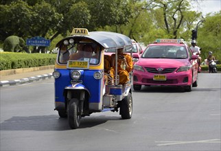 Tuk-tuk and taxis on the street