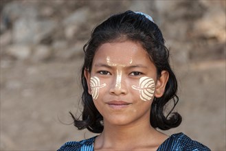 Burmese girl with Thanaka paste in the face