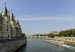 Conciergerie and a cruise ship on the Seine