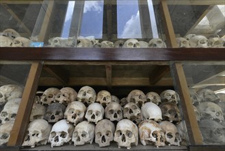 Skulls and bones in the Memorial Stupa to the prisoners murdered by the Communist or Maoist Khmer Rouge in Choeung Ek
