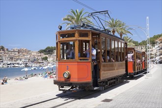 The historic ""Red Lightning"" tram on the promenade