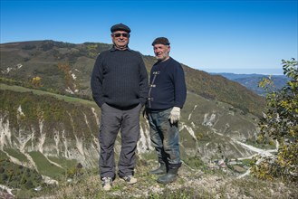 Old Chechen men at an overlook in the Chechen mountains