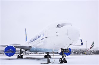 Condor Boeing B 767-300 aircraft in parking position in the snow