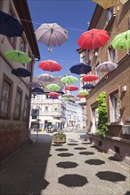 Altstadtgasse with colorful umbrellas