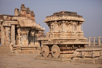 Garuda shrine as stone temple car or Ratha in front of Vitthala Temple