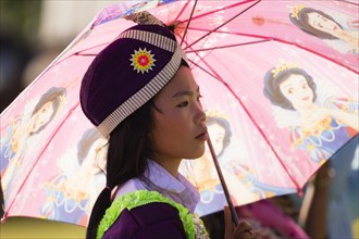 Young woman dressed in a traditional Hmong costume