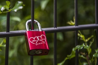 Love lock on a bridge railing