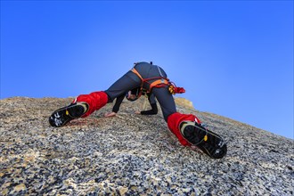 Climber climbing on a rock wall