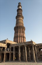 Columns of Quwwat-ul-Islam Mosque Courtyard and Qutb Minar