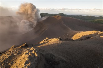 People on the crater rim of Mount Yasur volcano