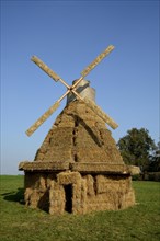 Windmill made of straw bales