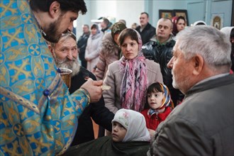 Blessing of the sick at the Feast of Epiphany in the church of the Orthodox Old Believers