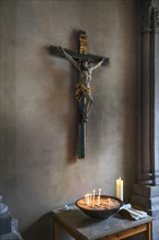 Crucifix and votive candles