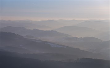 The hills of the northern Sauerland in the morning mist in Meschede