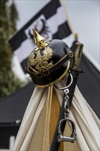 German spiked helmet put up on a tent