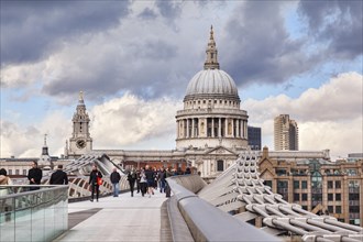 St Paul's Cathedral from the Millennium Bridge with dramatic sky