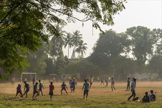 Teenagers playing football on Parade Ground