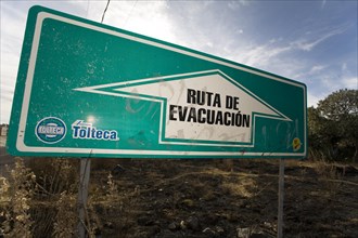 Evacuation sign in a village near the volcano Popocatepetl