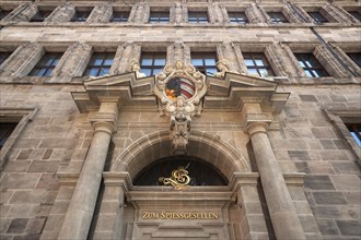 The right-hand portal of the west facade of the Renaissance-style Town Hall