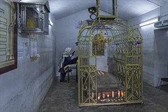 Grave of Hasidic Rabbi Elimelech in a gold-plated lattice at the Jewish cemetery of Lezajsk