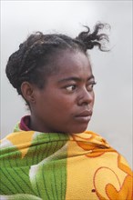Malagasy woman wrapped up in a blanket
