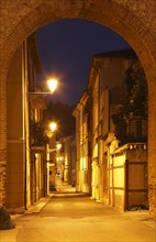 View through the city walls into Via Tiro a Segno