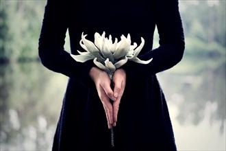 Woman with flower in hands