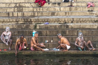 Indian People bathing on a ghat