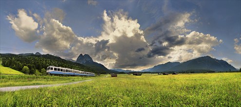 Zugspitze Railway with bizarre cloudy sky and summit of the Grosser Waxenstein