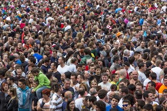 Densely packed crowd at a public festival