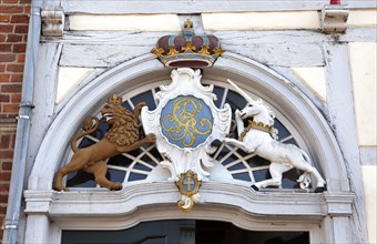 Entrance with coat of arms