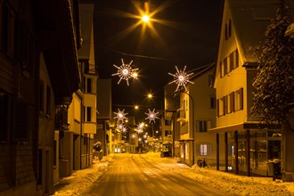 Snowy street with Christmas lights